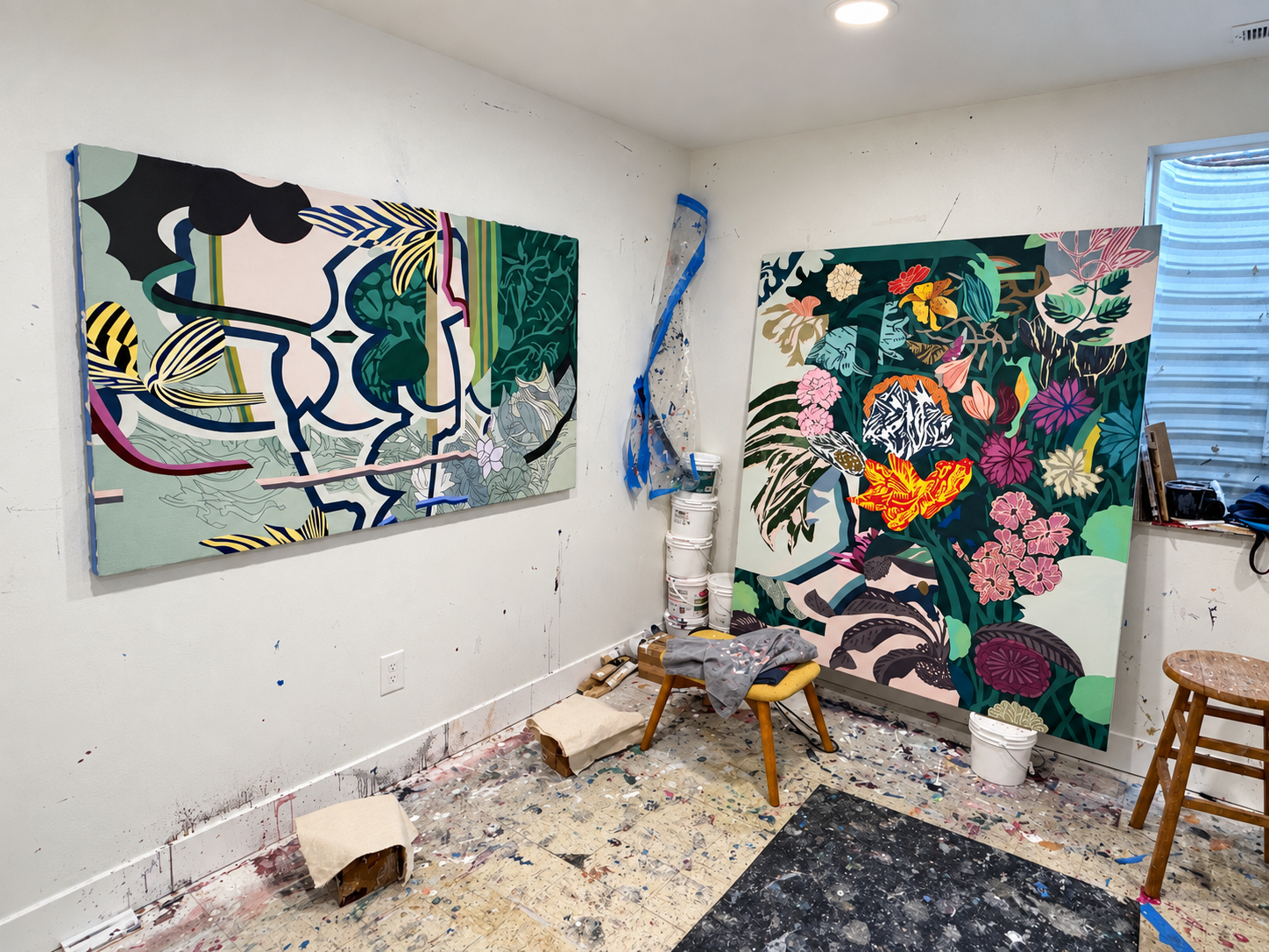 Two colorful botanical paintings in progress inside Rob Mellor’s Utah studio